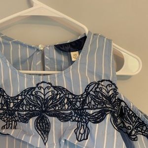 Light blue pinstripe blouse with flower detail